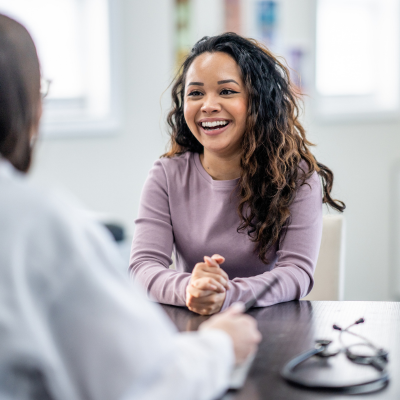 Young adult speaking with a provider