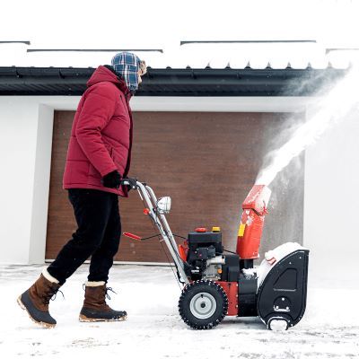 Person pushing a snowblower
