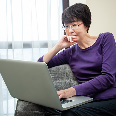 Older woman looking at a laptop