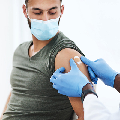 person getting bandaid after a shot 