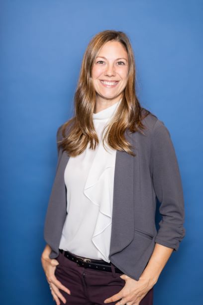 Woman in front of blue background