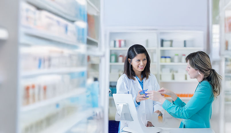 Woman talking to pharmacist 