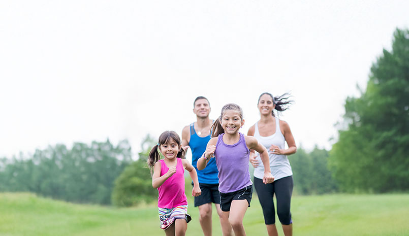 A family of four running
