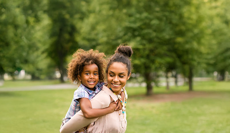 Mom holding daughter