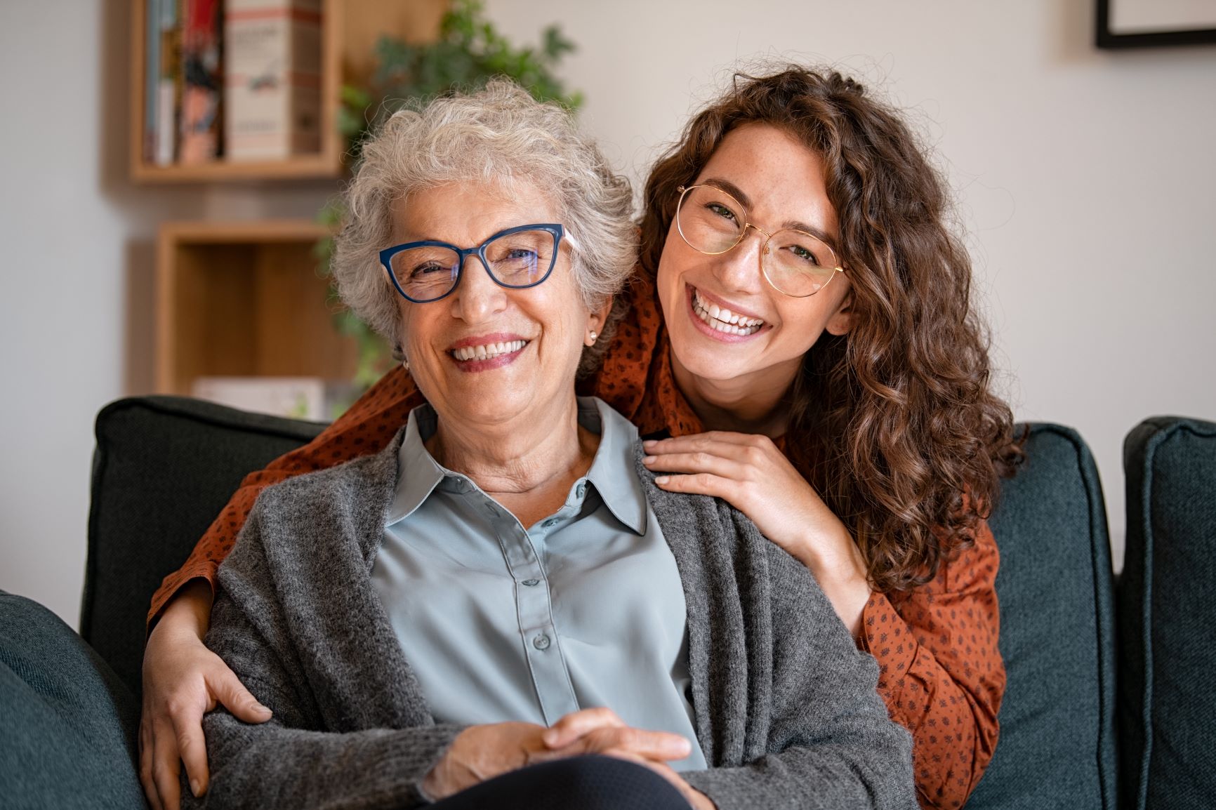 Woman hugging older woman